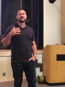 Daniel Alarik, creator of Grunt Style Clothing, speaks at Bluefield State College during "Wolf Pack," a two-day workshop for professionals in criminal justice, law enforcement, and related fields.